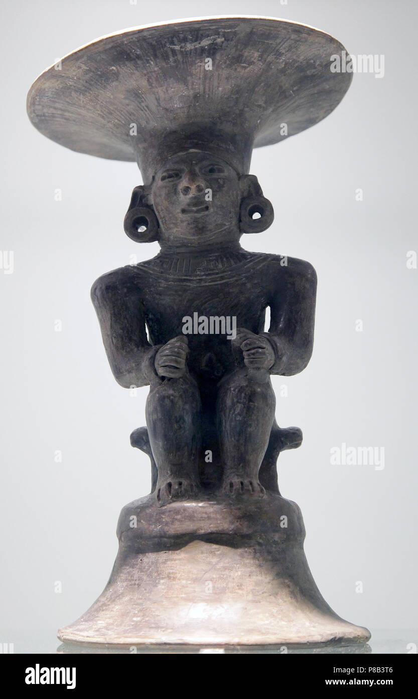 Ceramic Seated Male with Headdress from The Manteño civilization.the last pre-Columbian civilization in modern-day Ecuador active from 850 to 1600 AD Stock Photo