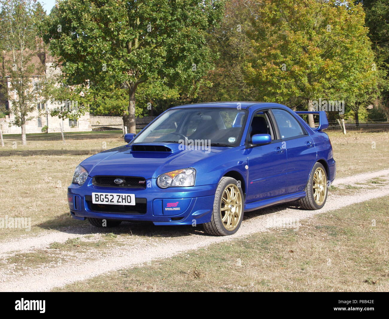 Subaru Impreza WRX STI in WR blue pearl colour with alloy wheels - showing front and side view Stock Photo