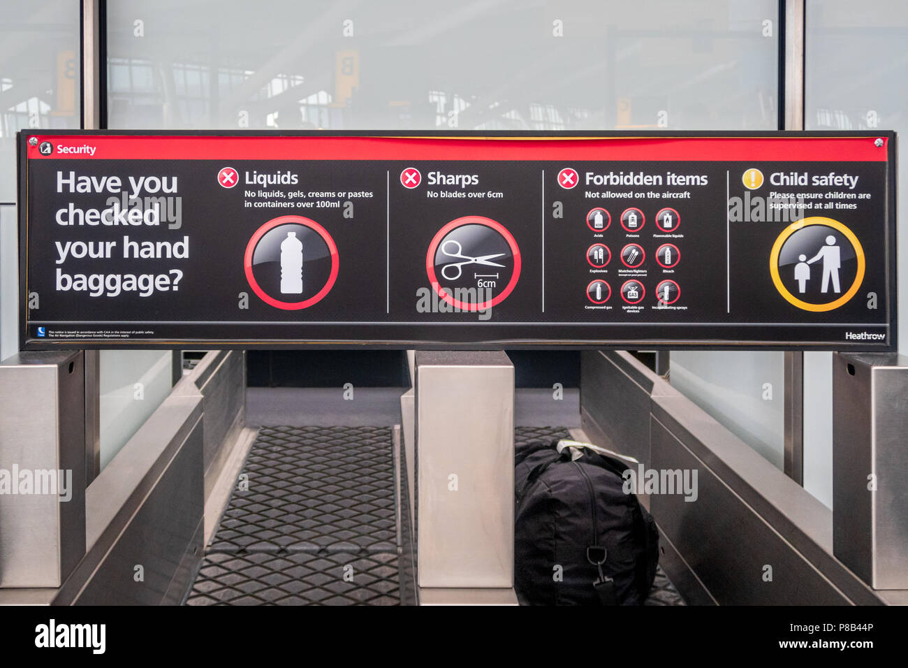 Heathrow Airport security sign showing forbidden hand luggage items Stock Photo
