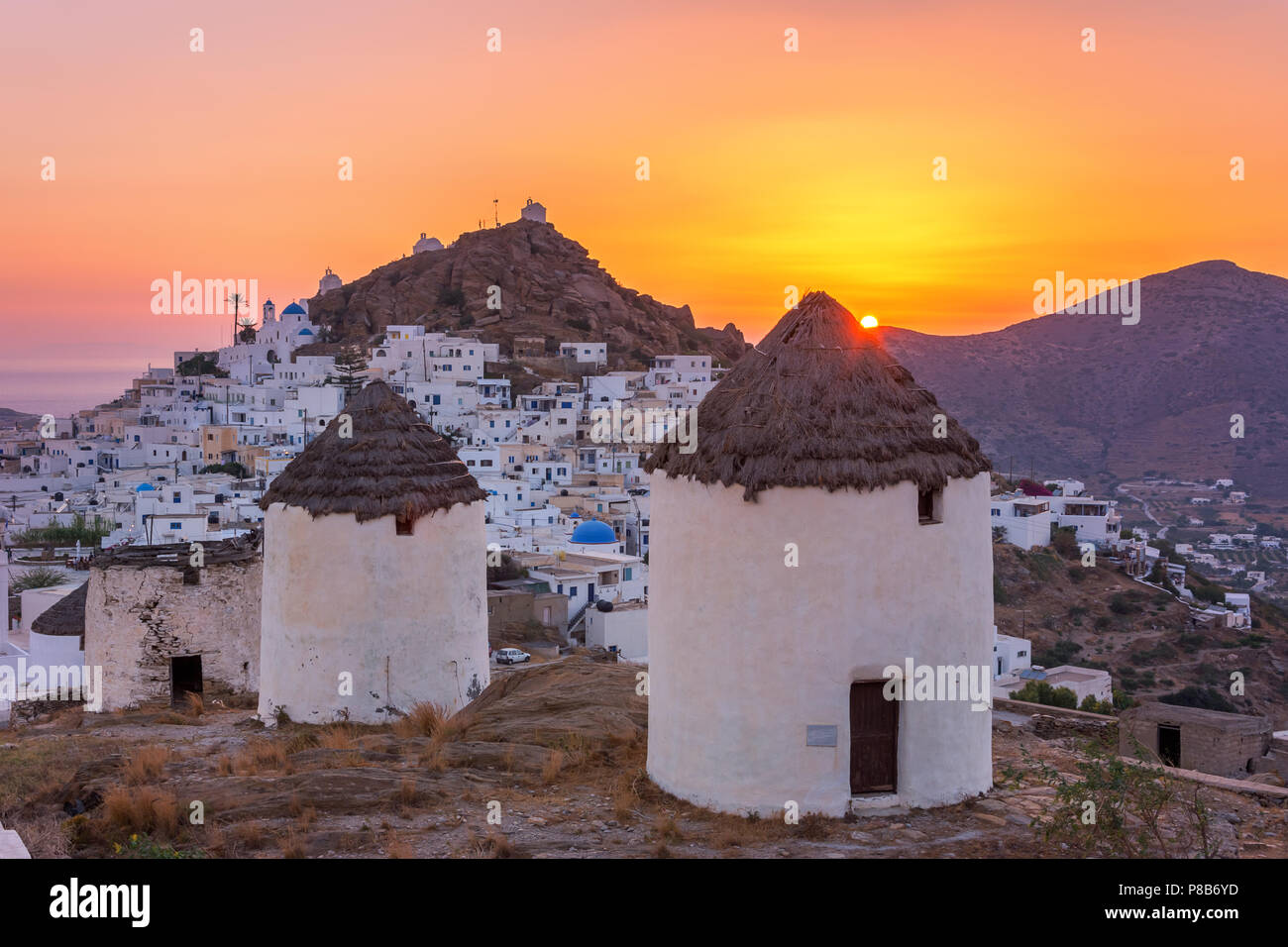 Iconic traditional wind mills in Ios island, Cyclades, Greece Stock ...