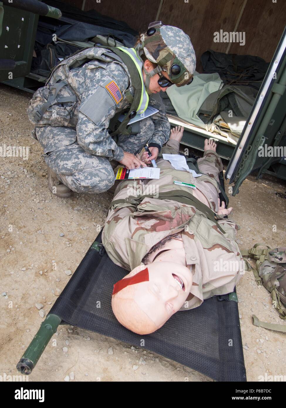 U.S. Army Reserve Soldiers with 865th Combat Support Hospital, based in Utica, N.Y. perform patient evaluations as part of a mass casualty exercise during Regional Medic CSTX 86-18-04, at Tactical Training Base Justice on Fort McCoy, Wisc. June 23, 2018, June 23, 2018. CSTX 86-18-04 is a Combat Support Training Exercise that ensures America's Army Reserve units and Soldiers are trained and ready to deploy on short-notice and bring capable, combat-ready, and lethal firepower in support of the Army and our joint partners anywhere in the world. U.S. Army Reserve photo by Staff Sgt. Eric W. Jones. Stock Photo