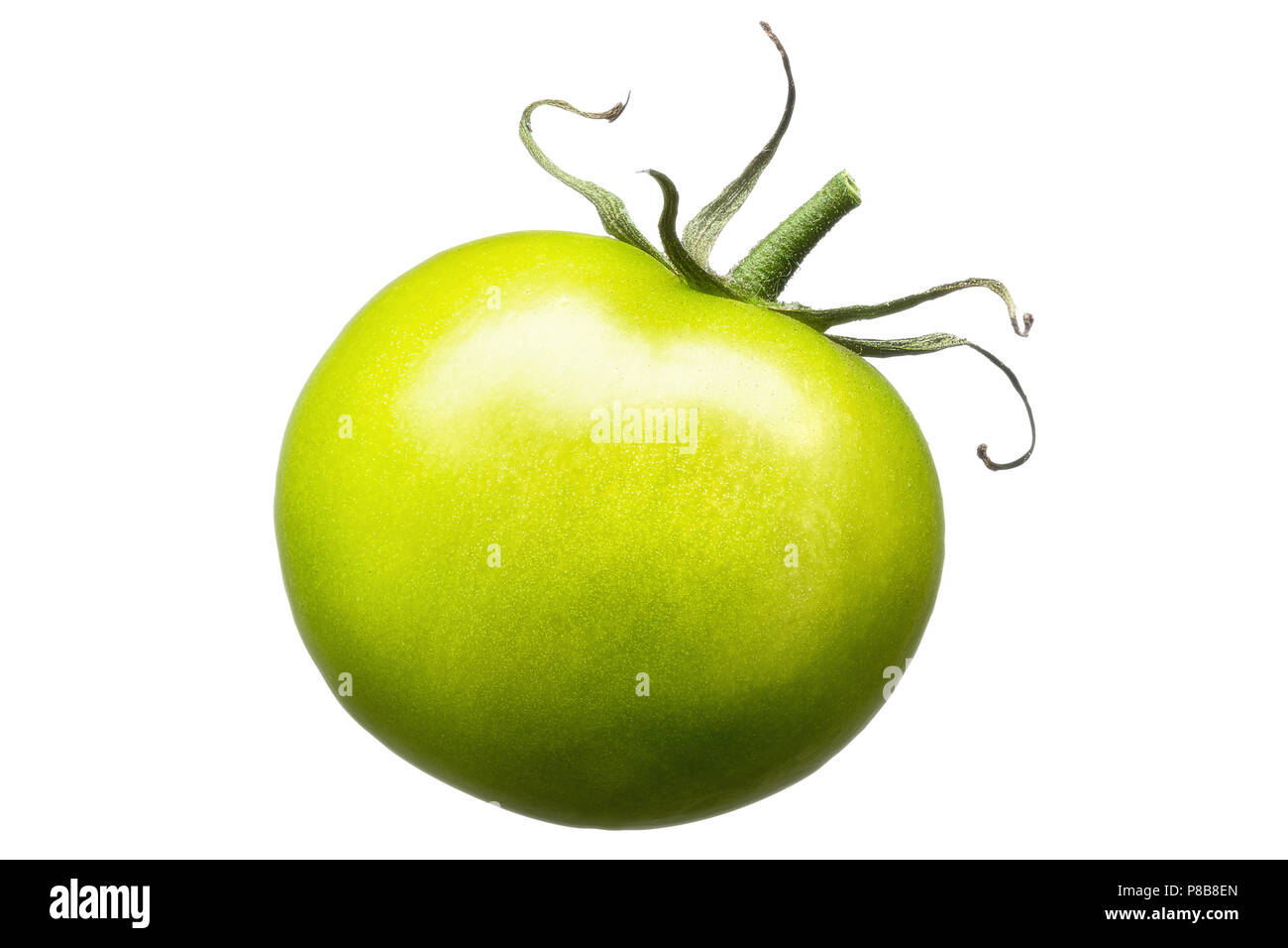 Single green tomato isolated on white background Stock Photo - Alamy
