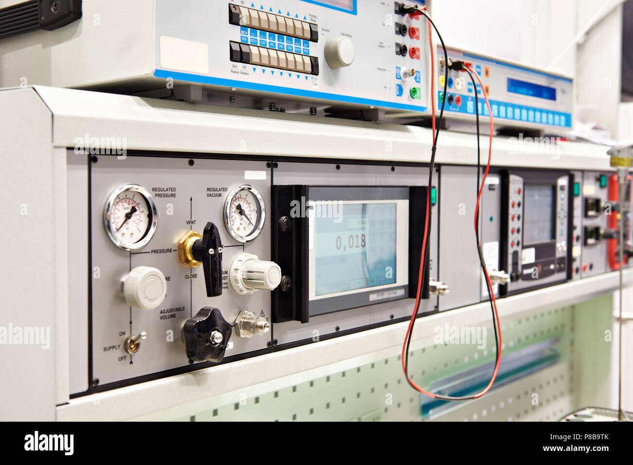 Universal testing and metrological stands with control panel Stock Photo