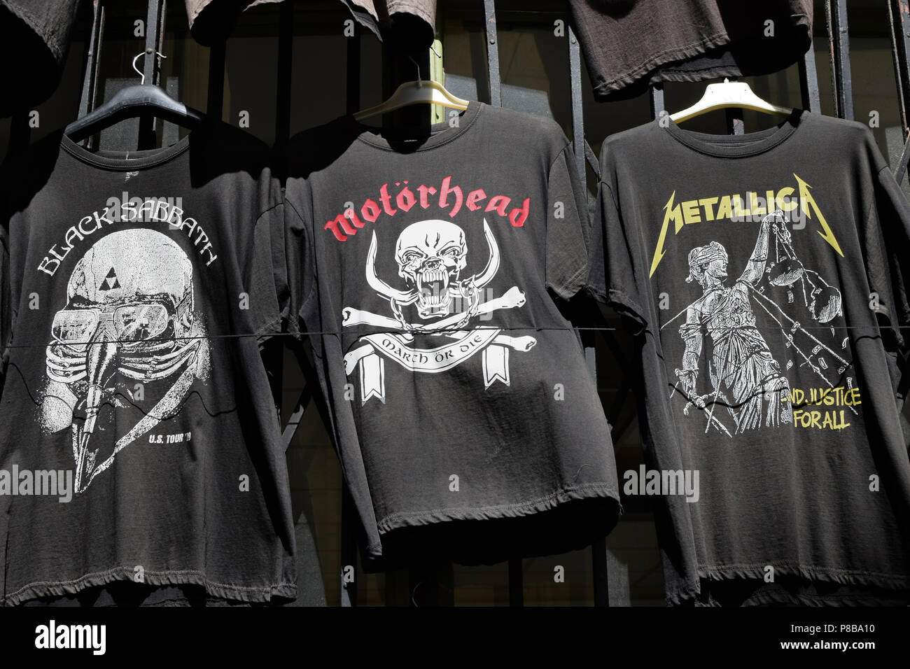 ATHENS, GREECE - APRIL 1, 2018: T-shirts for sale printed with heavy metal and hard rock music band logos. Stock Photo