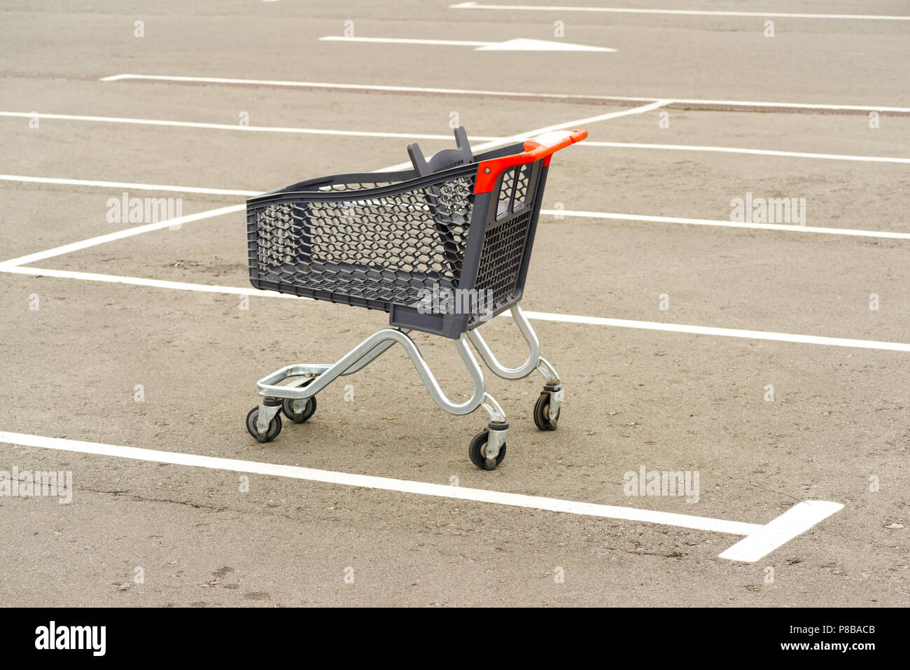 Shopping trolley in the parking lot Stock Photo Alamy