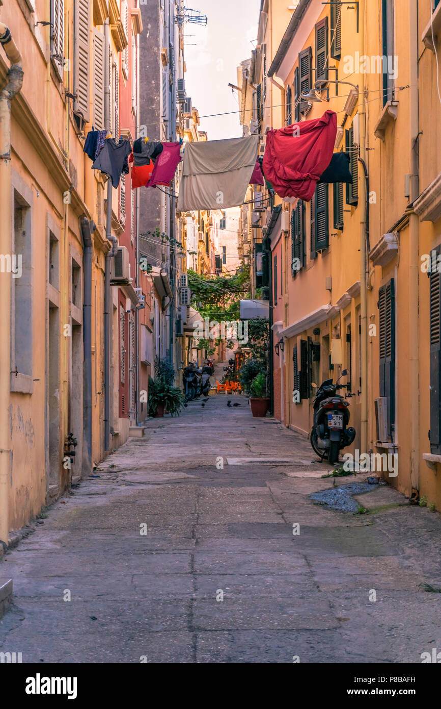 Clothes on a clothesline hung between buildings, Kerkira, Corfu Stock
