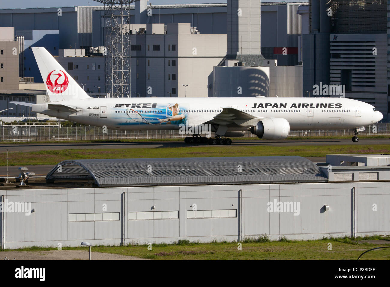 Japan Airlines (JAL) Boeing 777-300ER supporting japanese tennis player Kei Nishikori seen taxiing at Tokyo Haneda airport Stock Photo