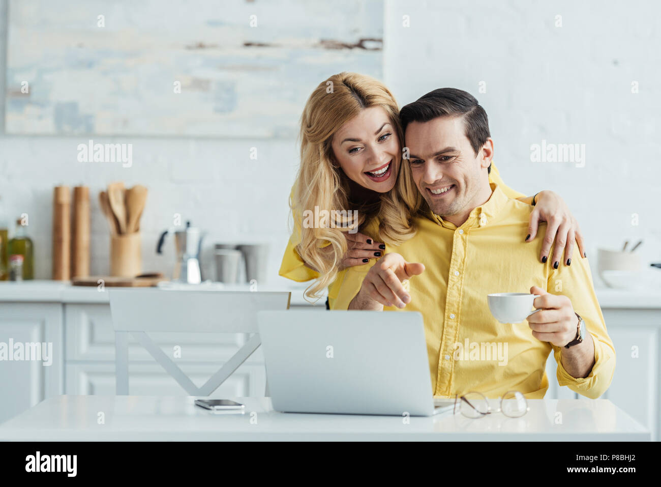 Woman hugging computer screen hi-res stock photography and images - Alamy
