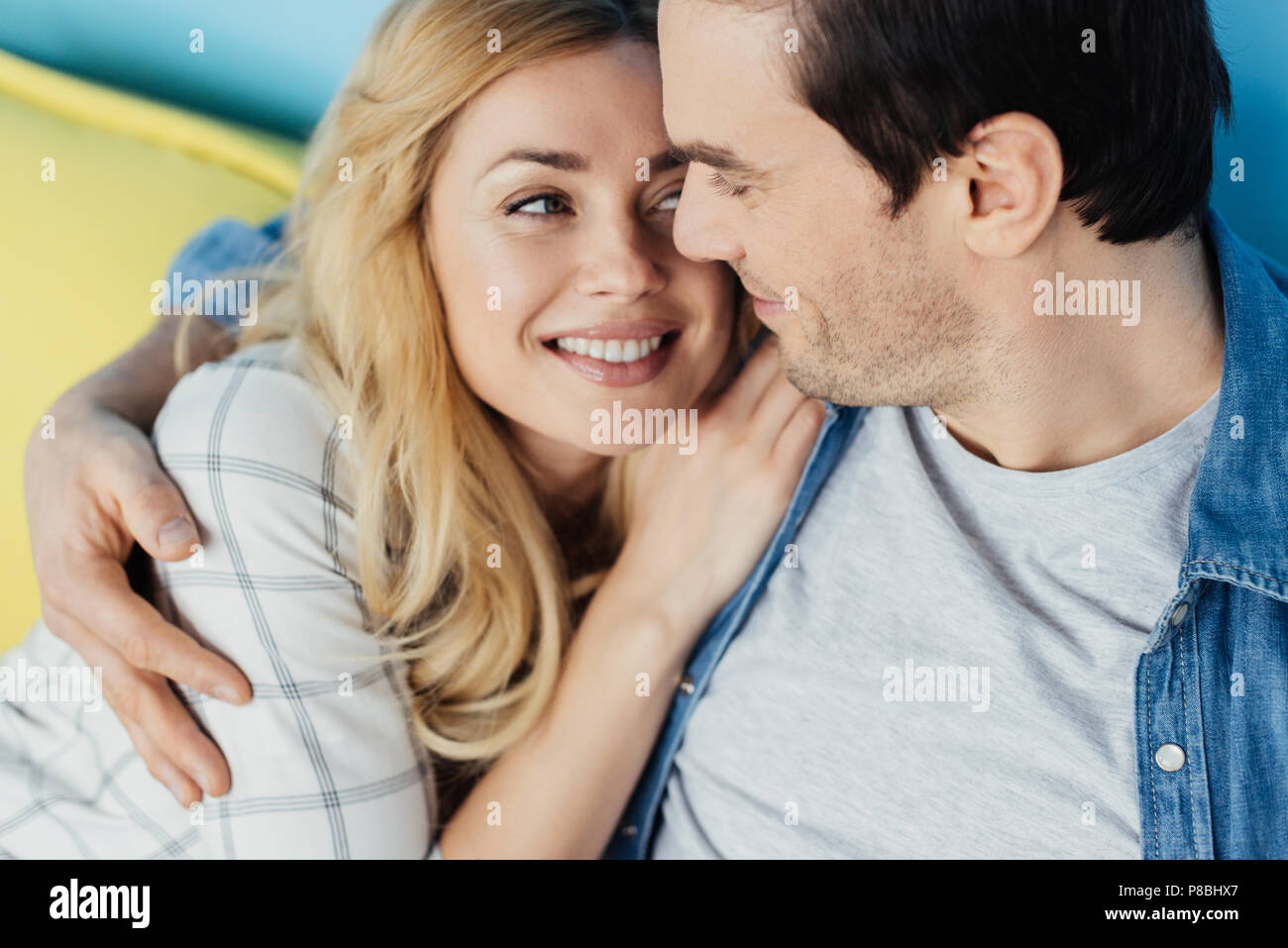 Pretty Blonde Woman Hugging Her Boyfriend Stock Photo Alamy