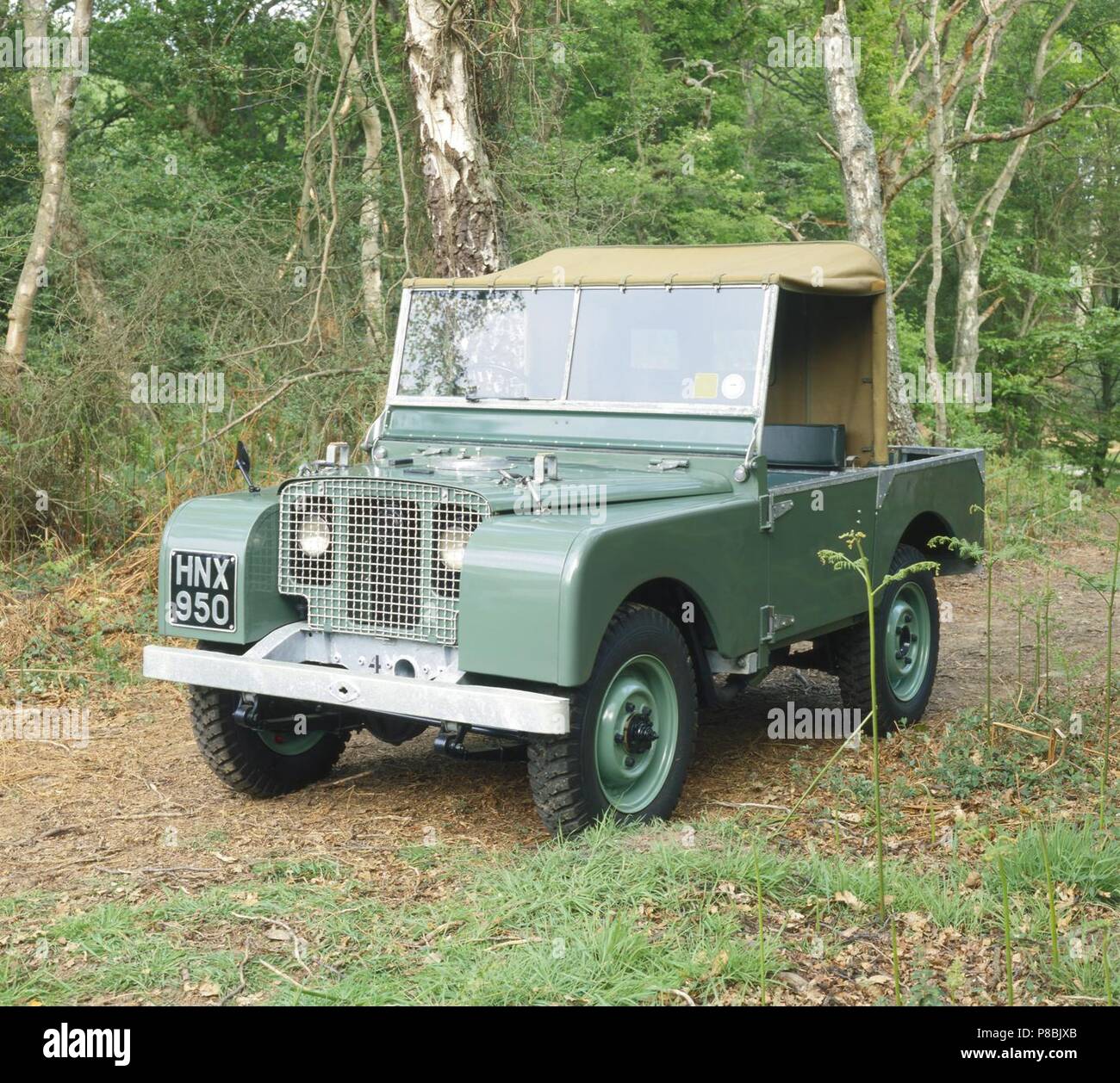 Land rover Series 1 one prototype number 4 in wooded countryside Stock Photo