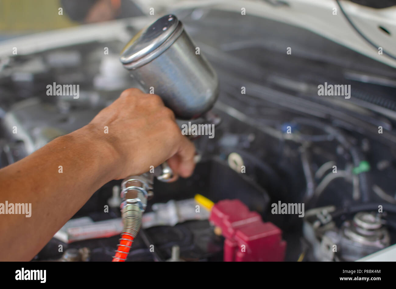 Man holding a car engine cleaning kit Stock Photo Alamy