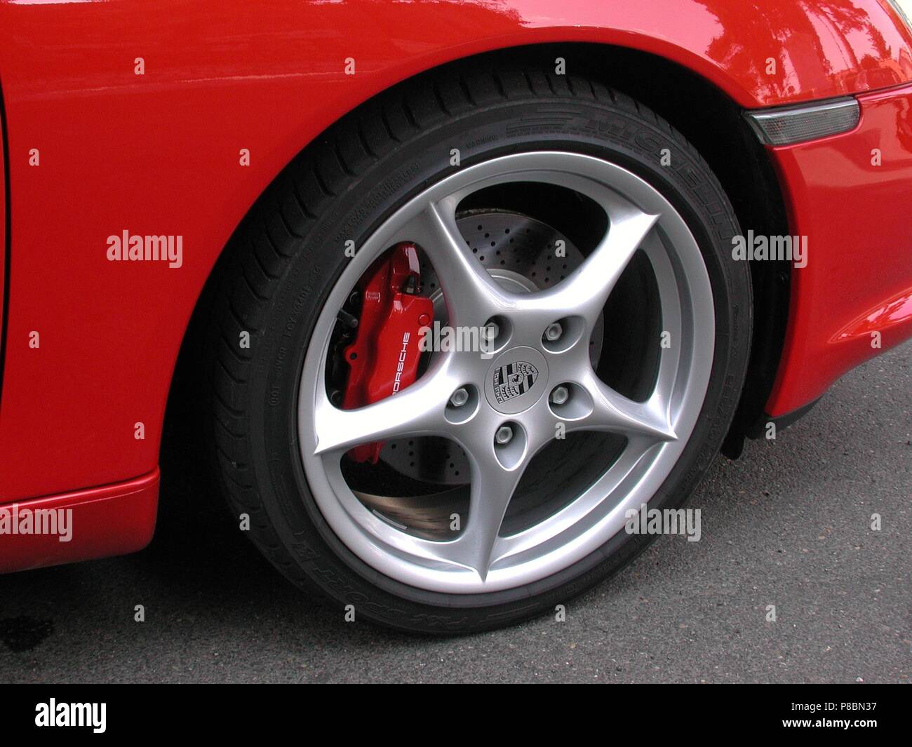 Porsche Boxster S in Red - 2002 model - showing close up of alloy wheel and brake calipers painted Stock Photo