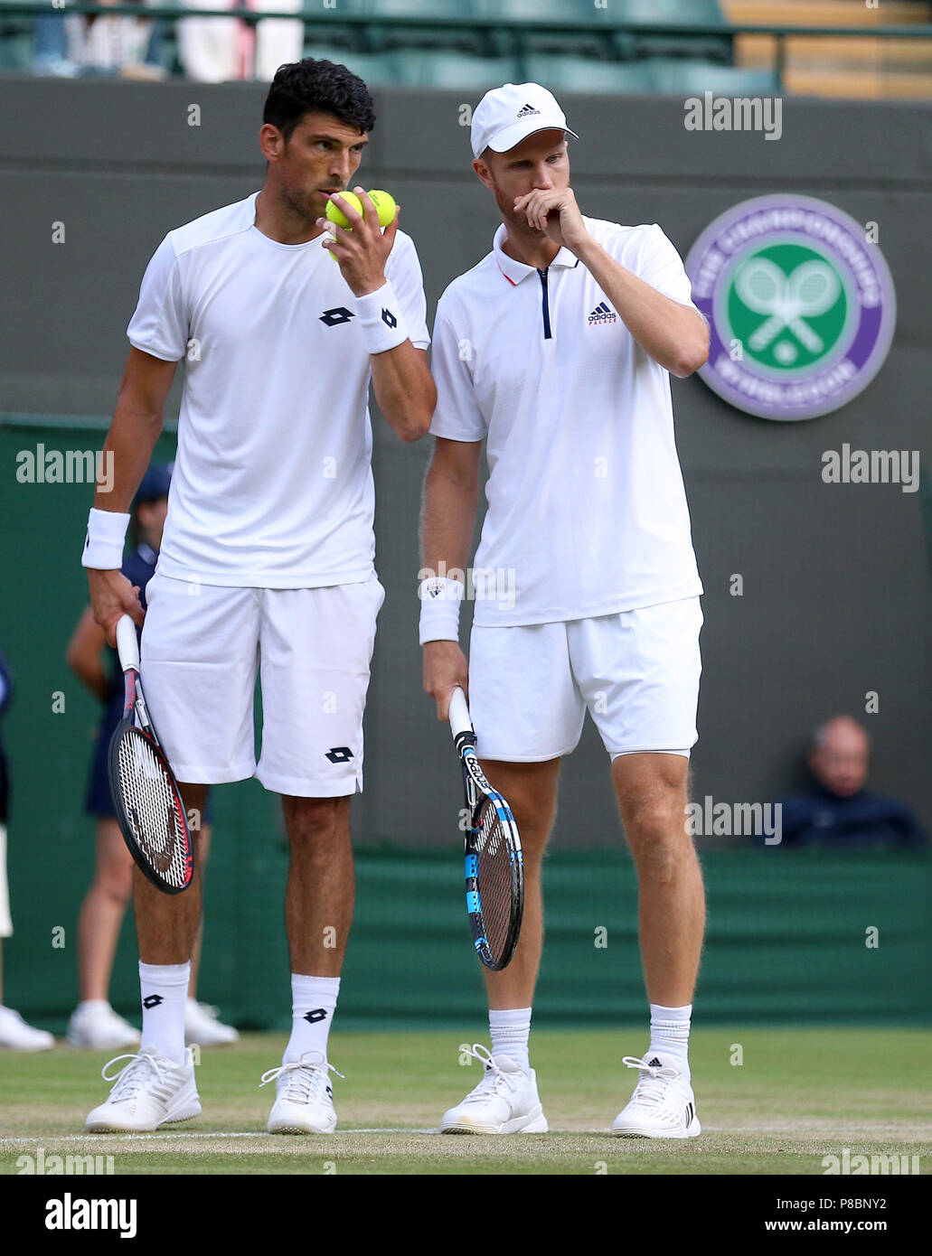 Dominic Inglot and Franko Skugor during their doubles match on day eight of  the Wimbledon Championships at the All England Lawn Tennis and Croquet  Club, Wimbledon. PRESS ASSOCIATION Photo. Picture date: Tuesday