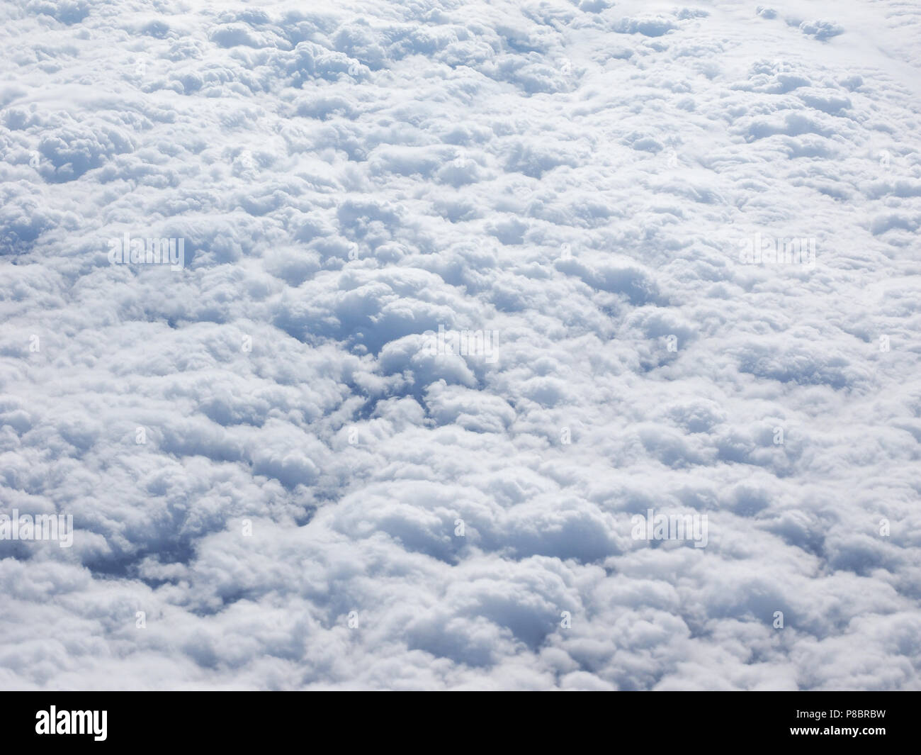 White clouds seen from above from an airplane useful as a background