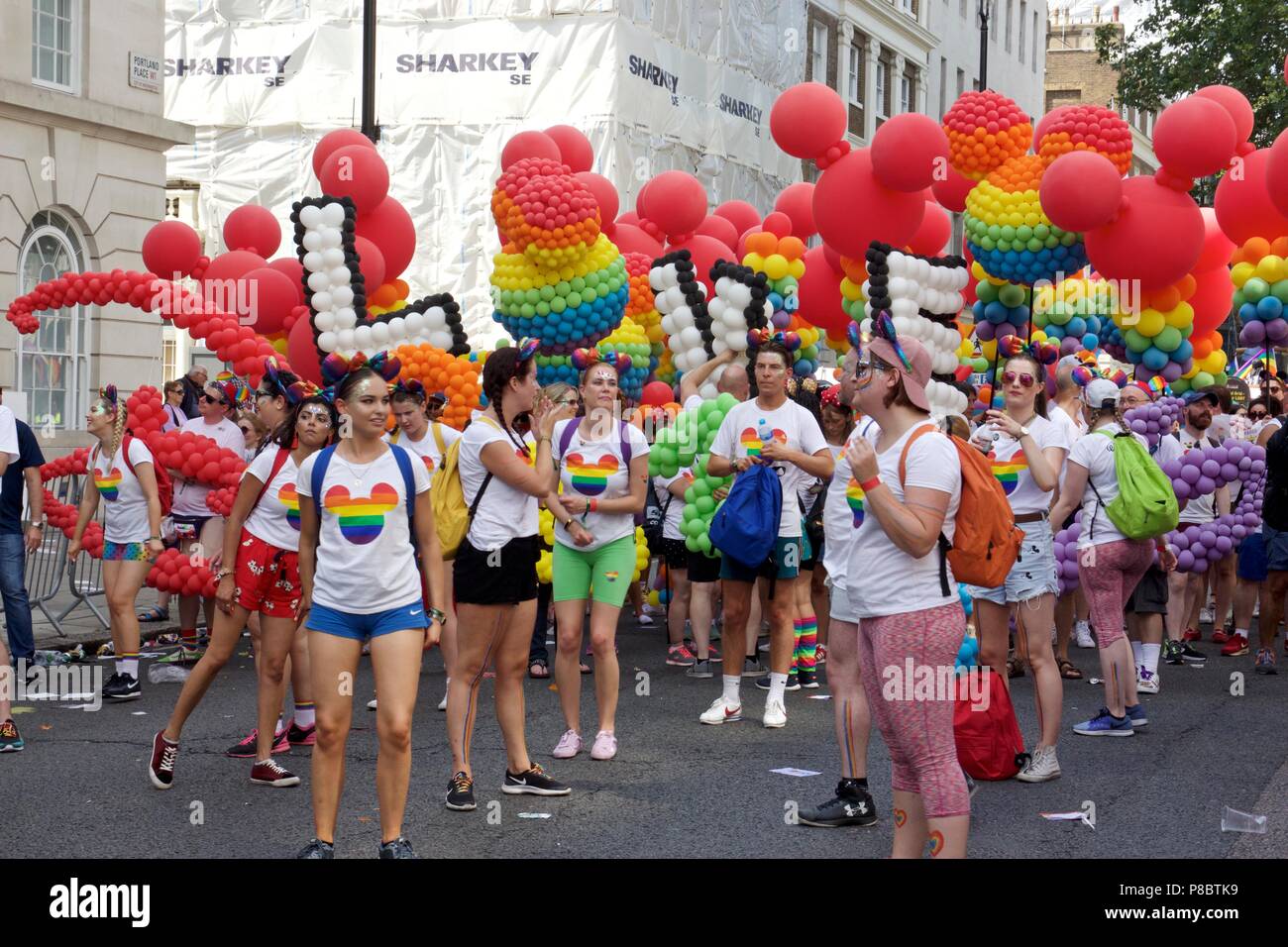 Disney employees with rainbow balloons at Pride in London 2018 Parade Stock Photo