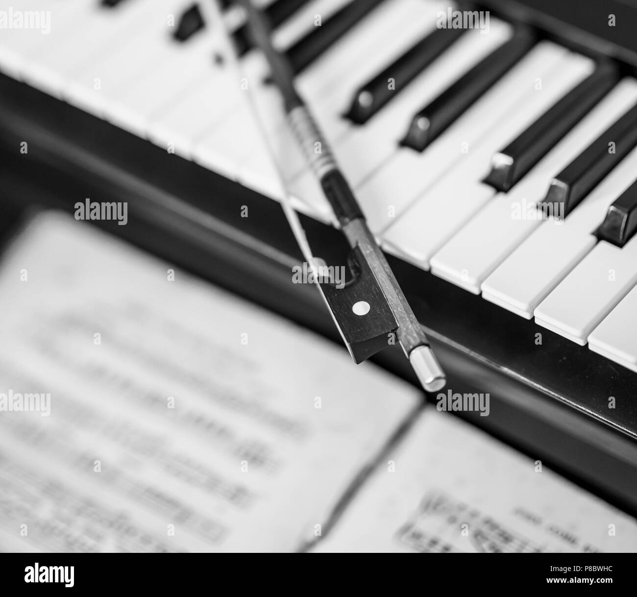 Music, keyboard and violin bow Stock Photo Alamy