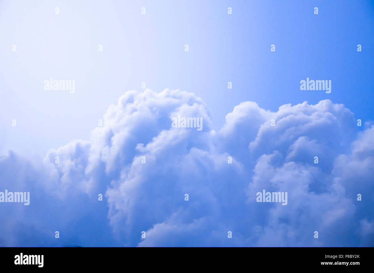 Blue sky background with cumulus cloud Stock Photo - Alamy
