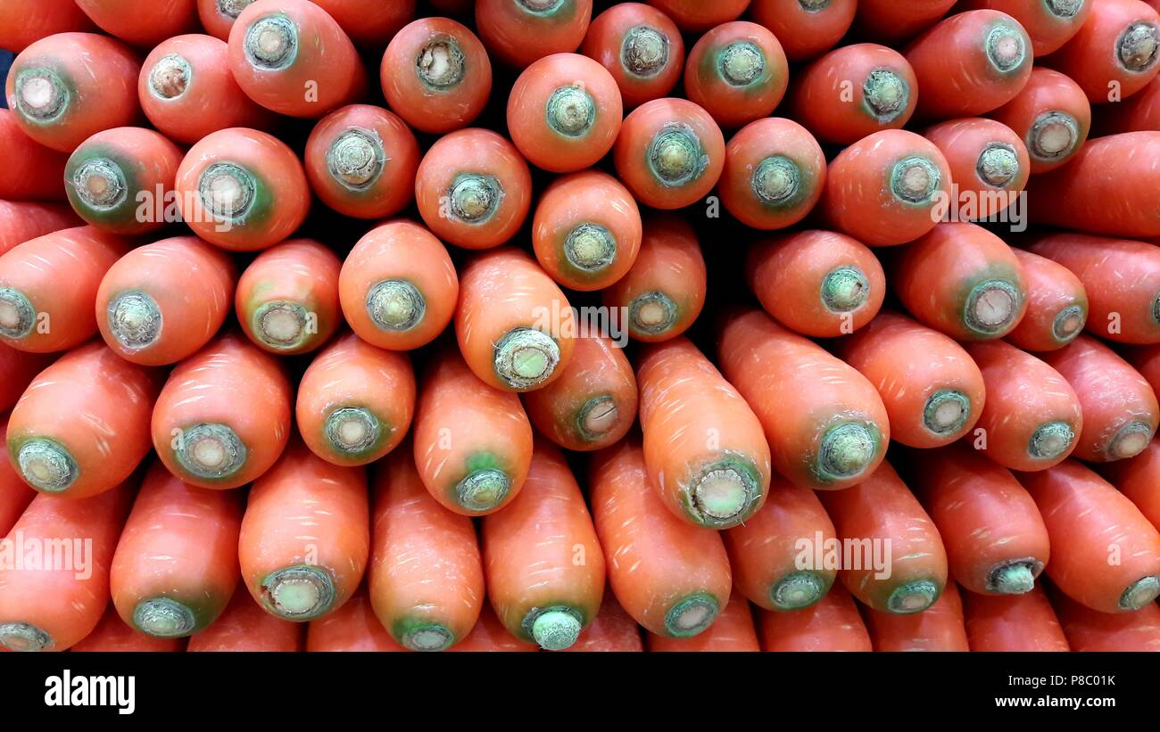 A lot of carrots (Daucus carota) in the market Stock Photo
