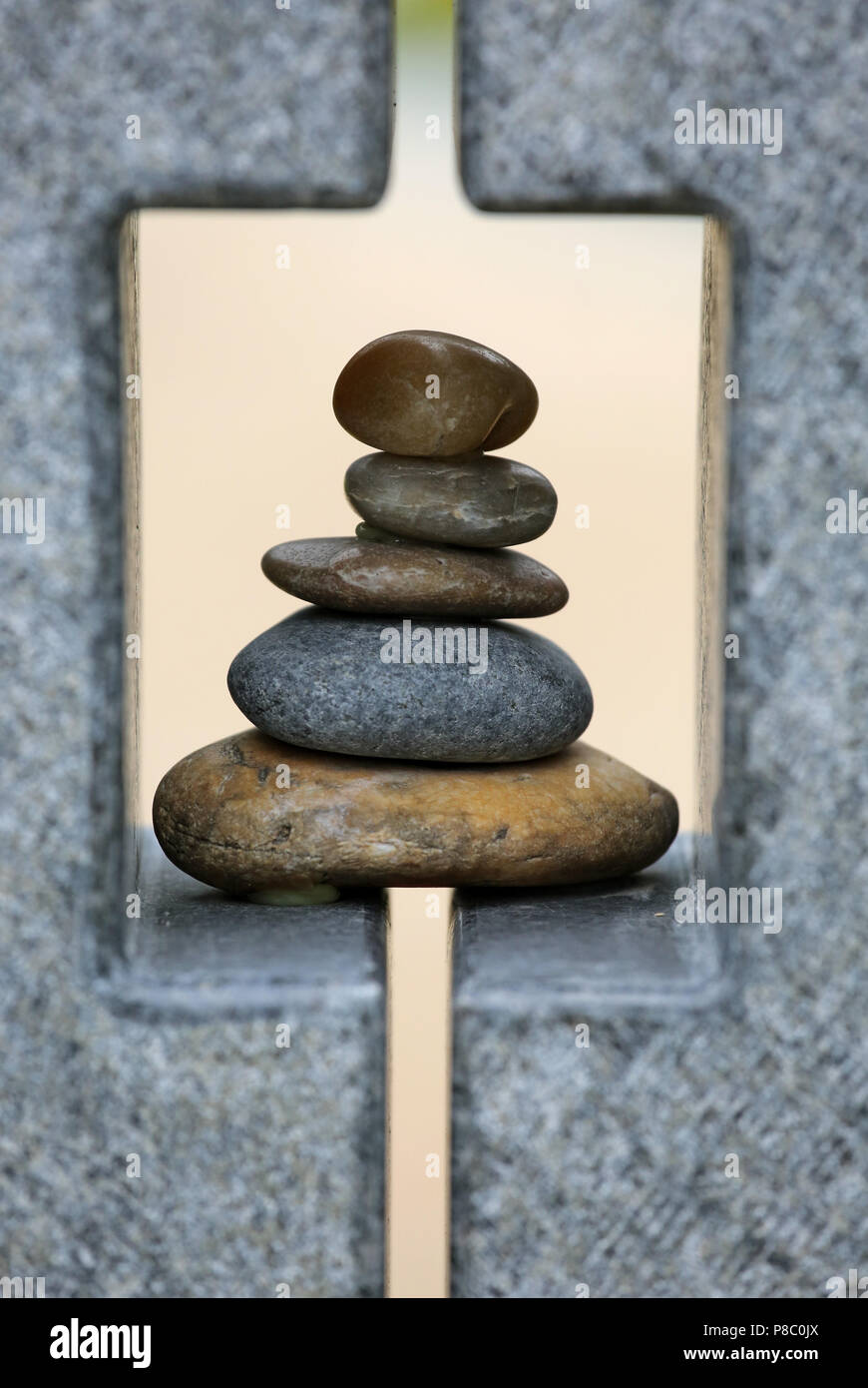 Berlin, Germany, artfully stacked pebbles in a stone frame Stock Photo