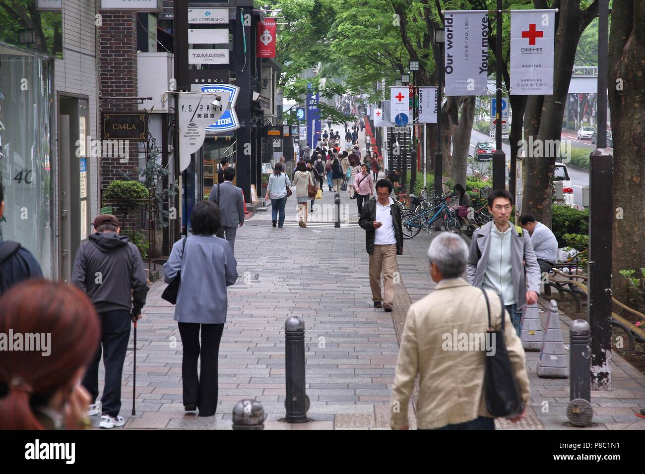 TOKYO, JAPAN - MAY 9, 2012: People shop in Omotesando district in Tokyo. Omotesando is considered one of most important shopping areas in Tokyo, the l Stock Photo