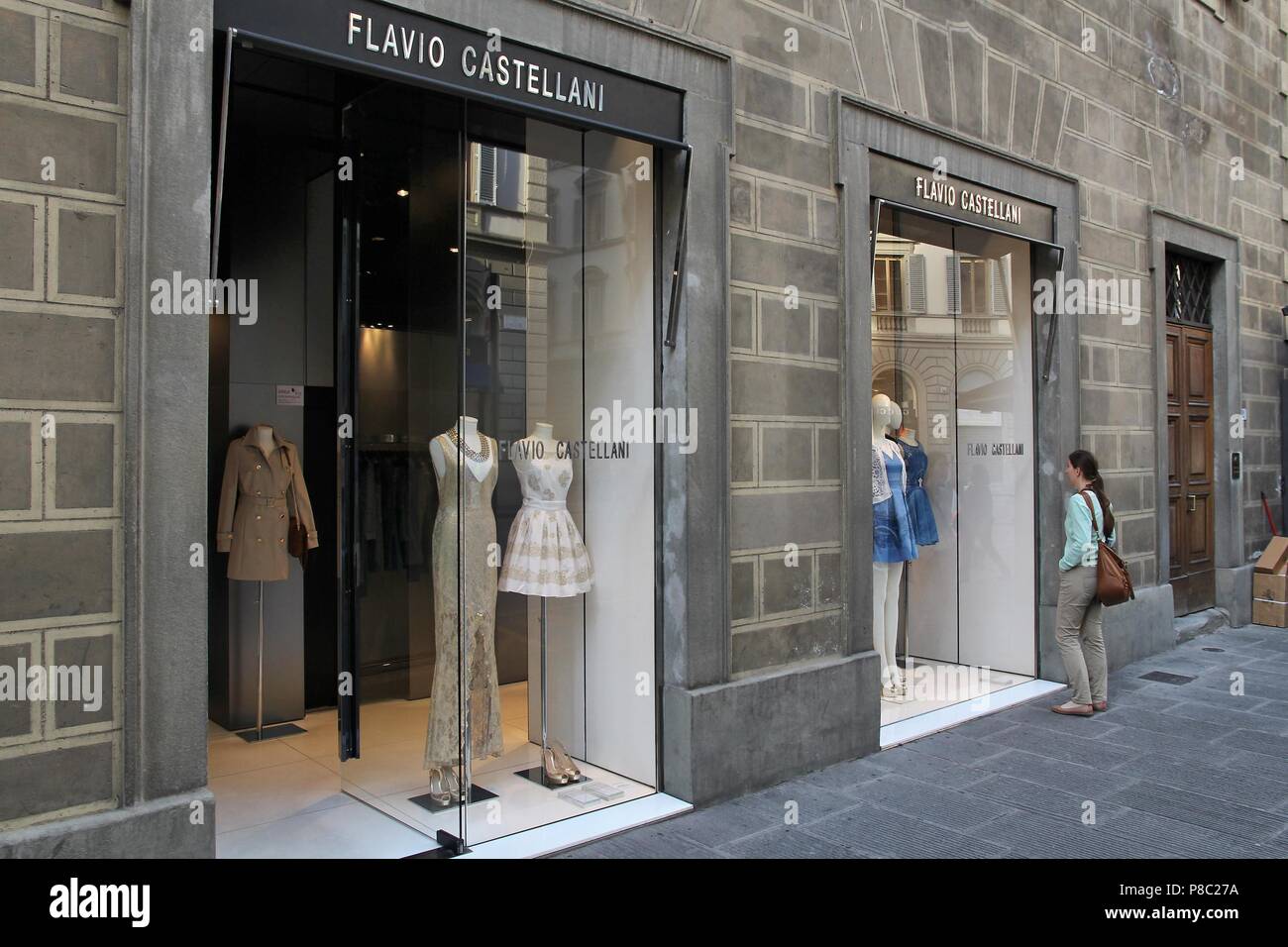 FLORENCE, ITALY - APRIL 30, 2015: Tourist visits Flavio Castellani fashion  store in Florence. The brand was founded in 1988 and is owned by Gioielli G  Stock Photo - Alamy