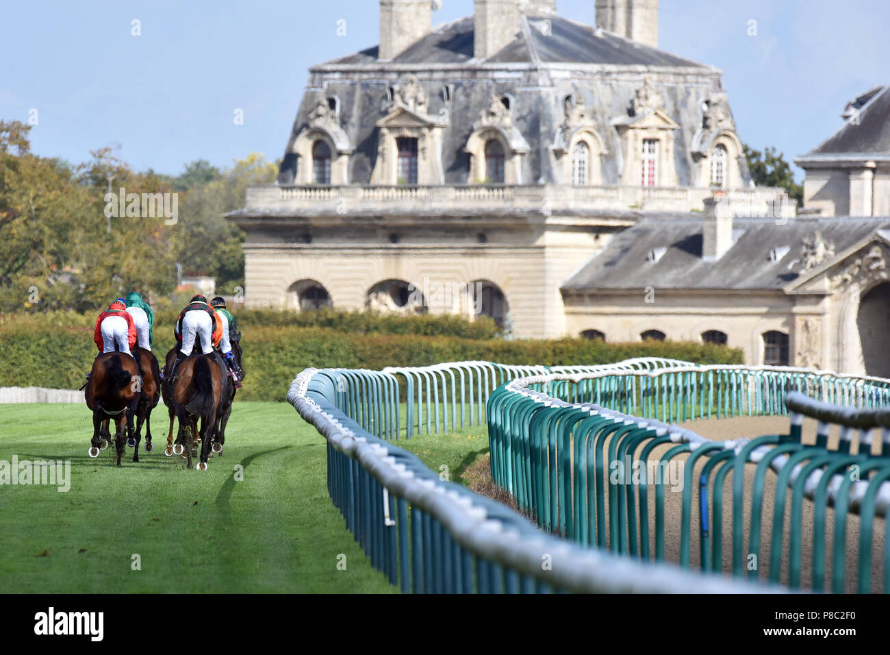 Chantilly, France, horses and jockeys during a gallop race Stock Photo