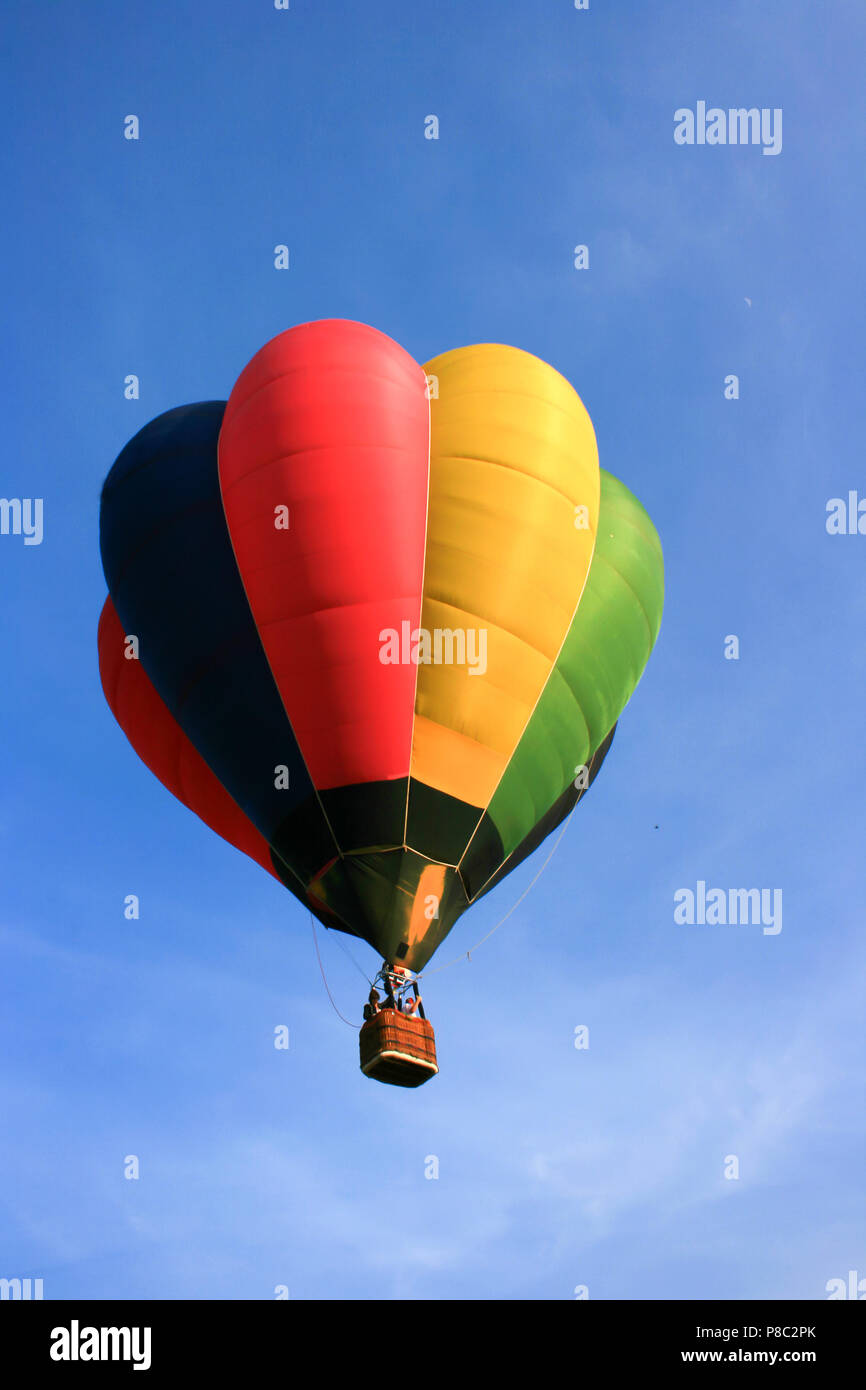 Colorful hot air balloon with blue sky background Stock Photo - Alamy