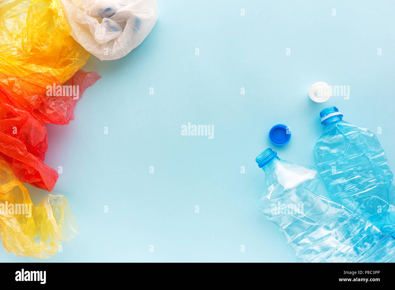 Used plastic bottles and bags for recycling, conceptual image with copy space Stock Photo