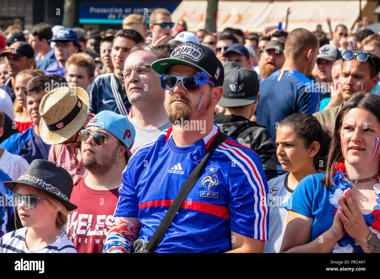 French football supporters cheering on the national team during the