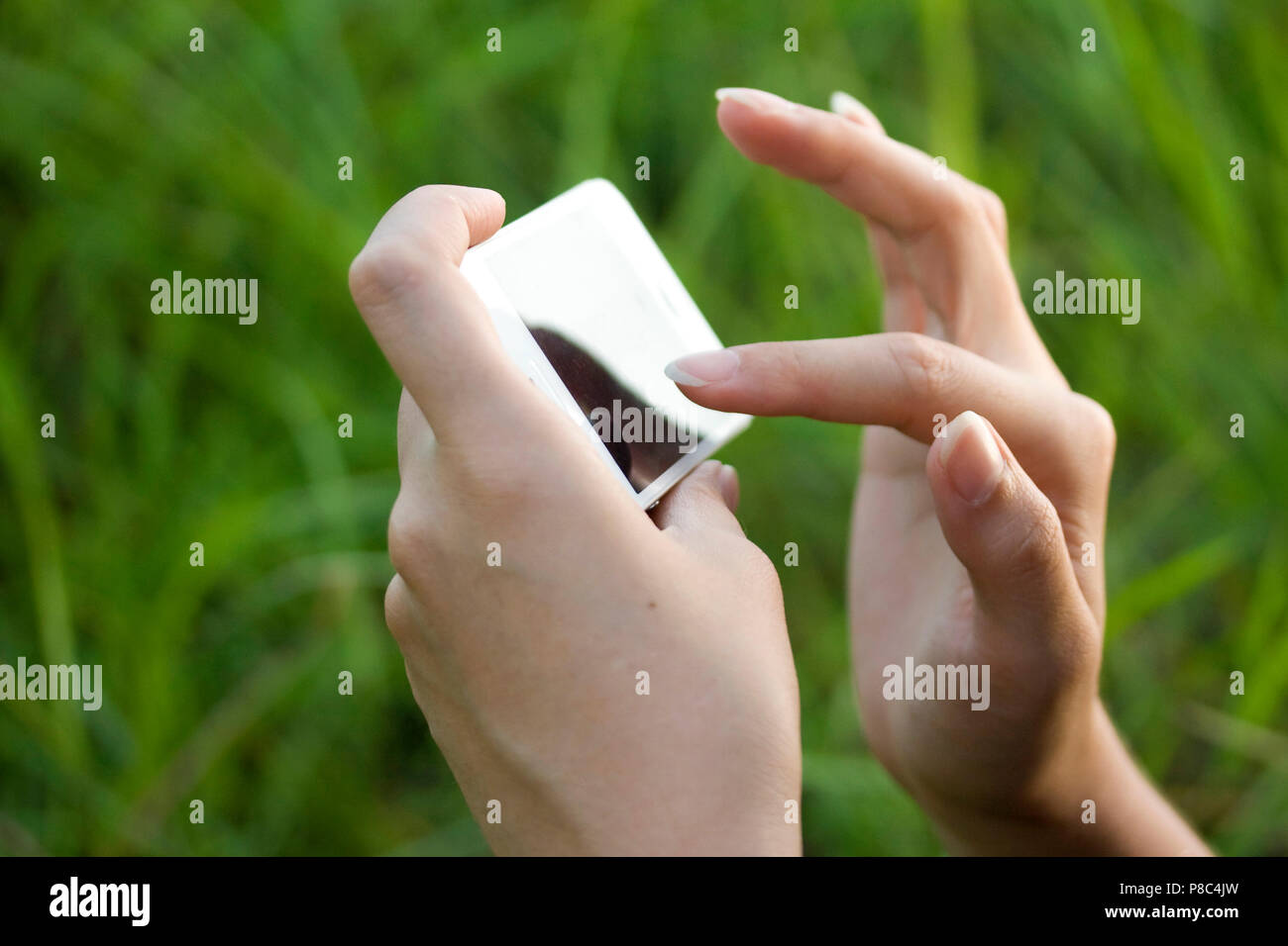 Using Mobile Stock Photo Woman using mobile green screen hi-res stock photography and images - Alamy