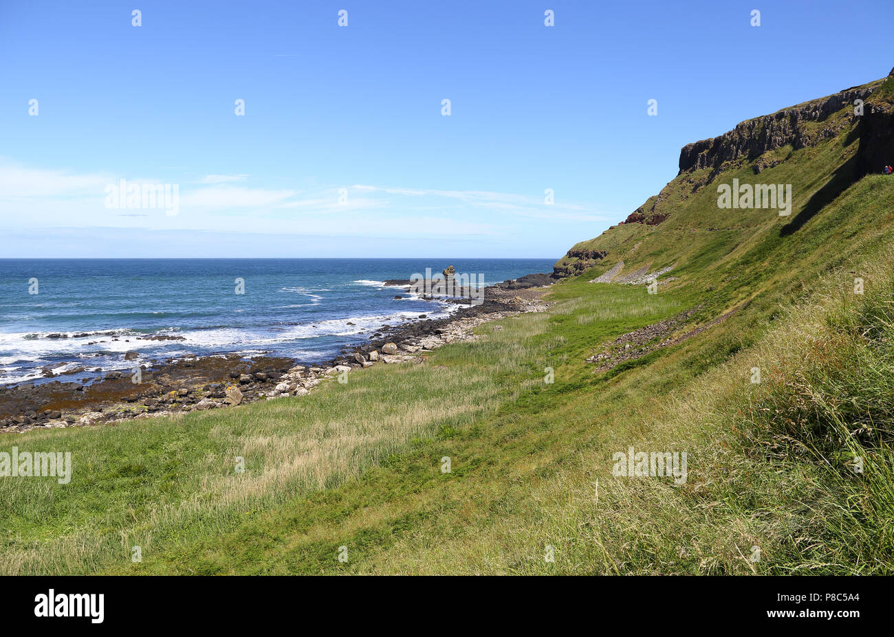 The Giant's Causeway is an area of about 40,000 interlocking basalt columns, the result of an ancient volcanic fissure eruption. It is located in Coun Stock Photo