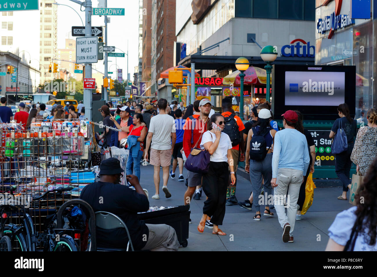 People, and street vendors on a busy, and crowded sidewalk opposite Union Square in Manhattan, New York, NY. (July 10, 2018) Stock Photo