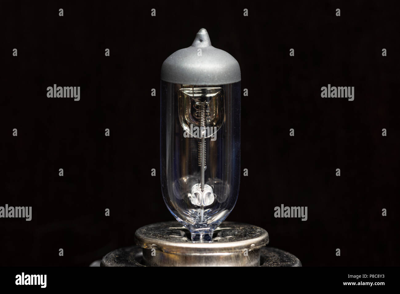 Close up of a motor vehicle halogen light bulb. isolated on a black background. Stock Photo