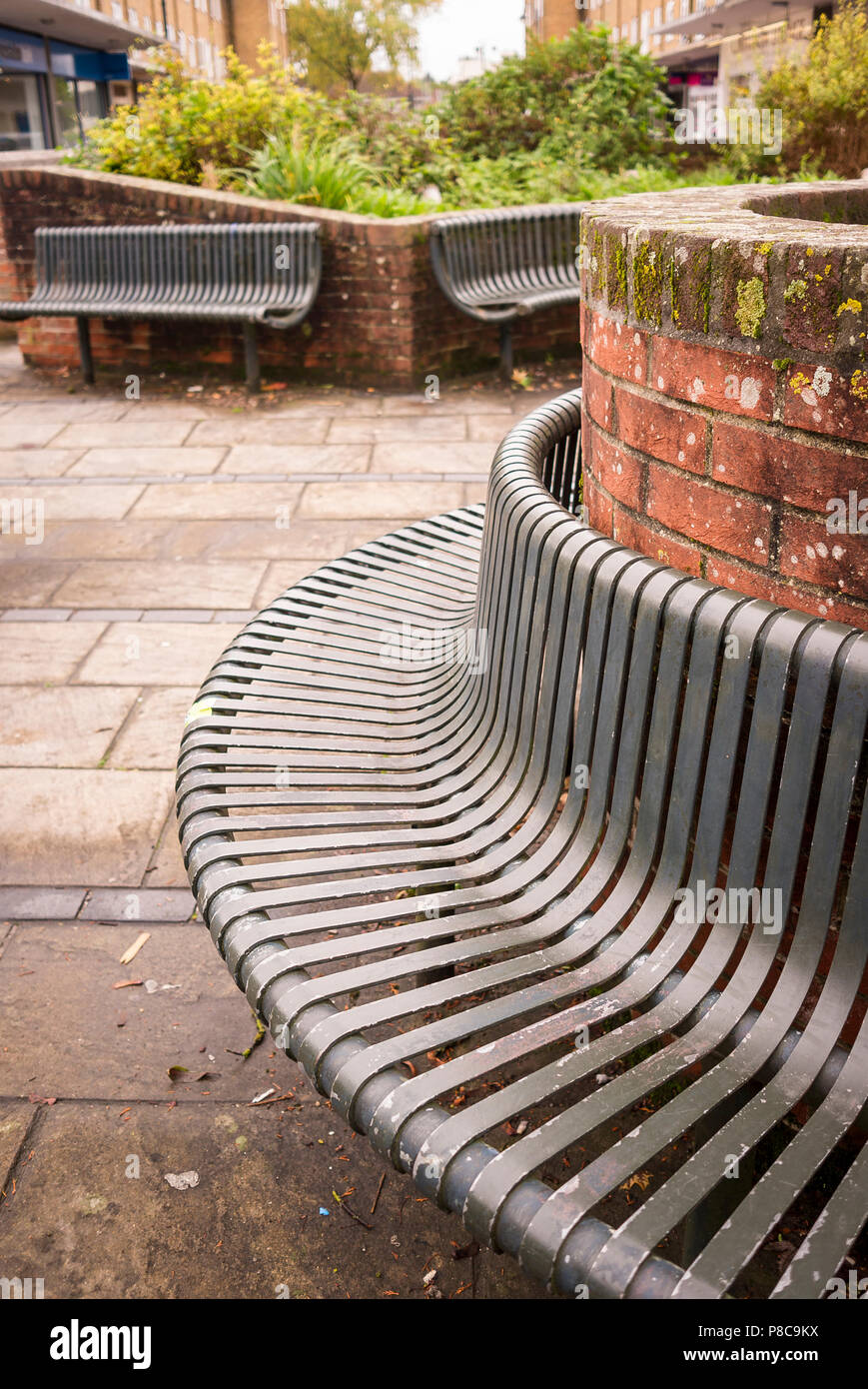 Modern metal vandal-proof public seating in Westbury Wiltshire England UK Stock Photo