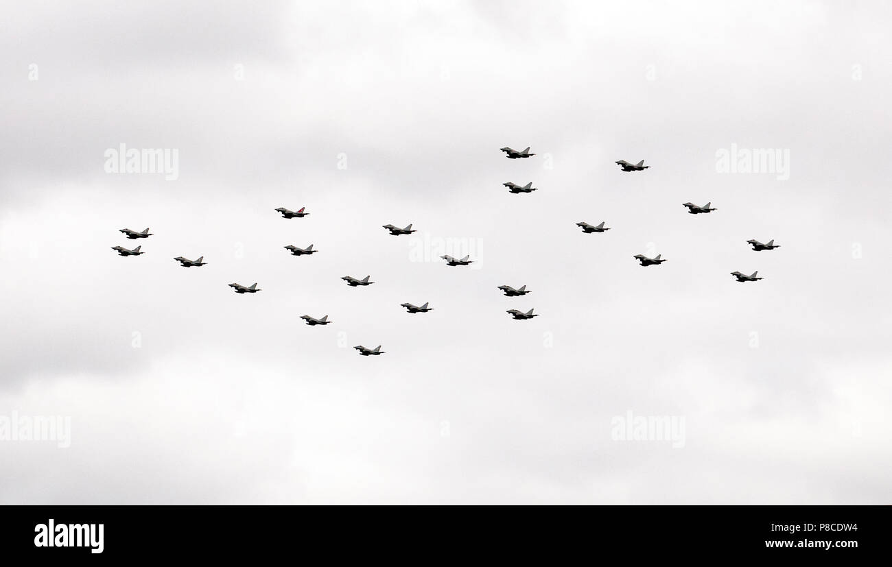 RAF Typhoons fly over the Queen Elizabeth  Olympic Park in a 100 formation, as part of the Centenary Celebrations Stock Photo