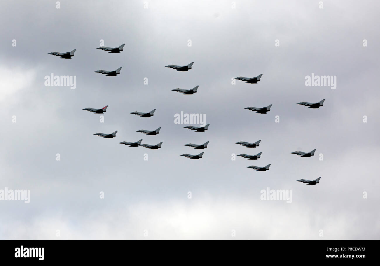 RAF Typhoons  fly over the Queen Elizabeth  Olympic Park in a 100 formation, as part of the Centenary Celebrations Stock Photo