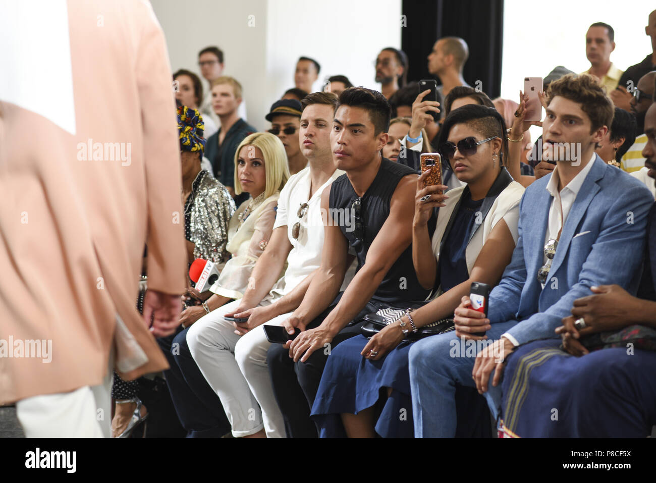 Guests watch for the runway at the Carlos Campos show. 9th July, 2018. Runway - July 2018 New York City Men's Fashion Week at Industria Studios on July 9, 2018 in New York City. Credit: Wonwoo Lee/ZUMA Wire/Alamy Live News Stock Photo