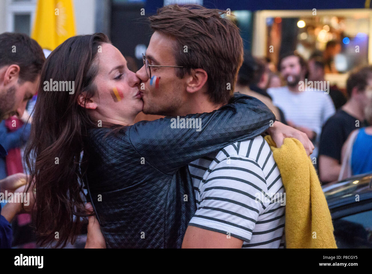 10.07.2018. BRUSSELS, BELGIUM. Football fans of Belgium and France kissing after FIFA WORLD CUP 2018 game between team Belgium and team France. Stock Photo