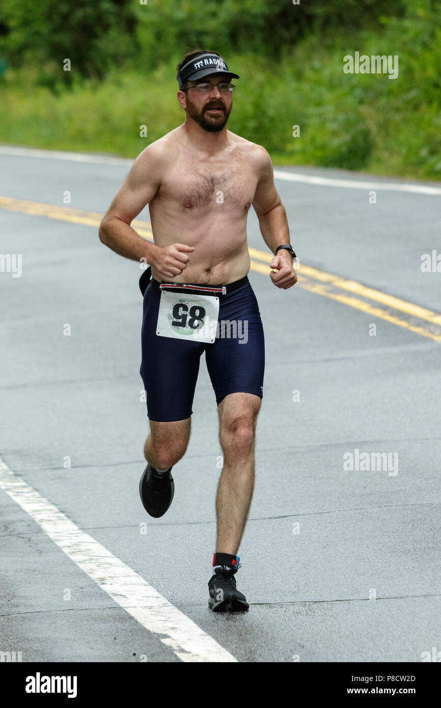 Male competitor during the run segment in the 2018 Hague Endurance Festival Sprint Triathlon Stock Photo