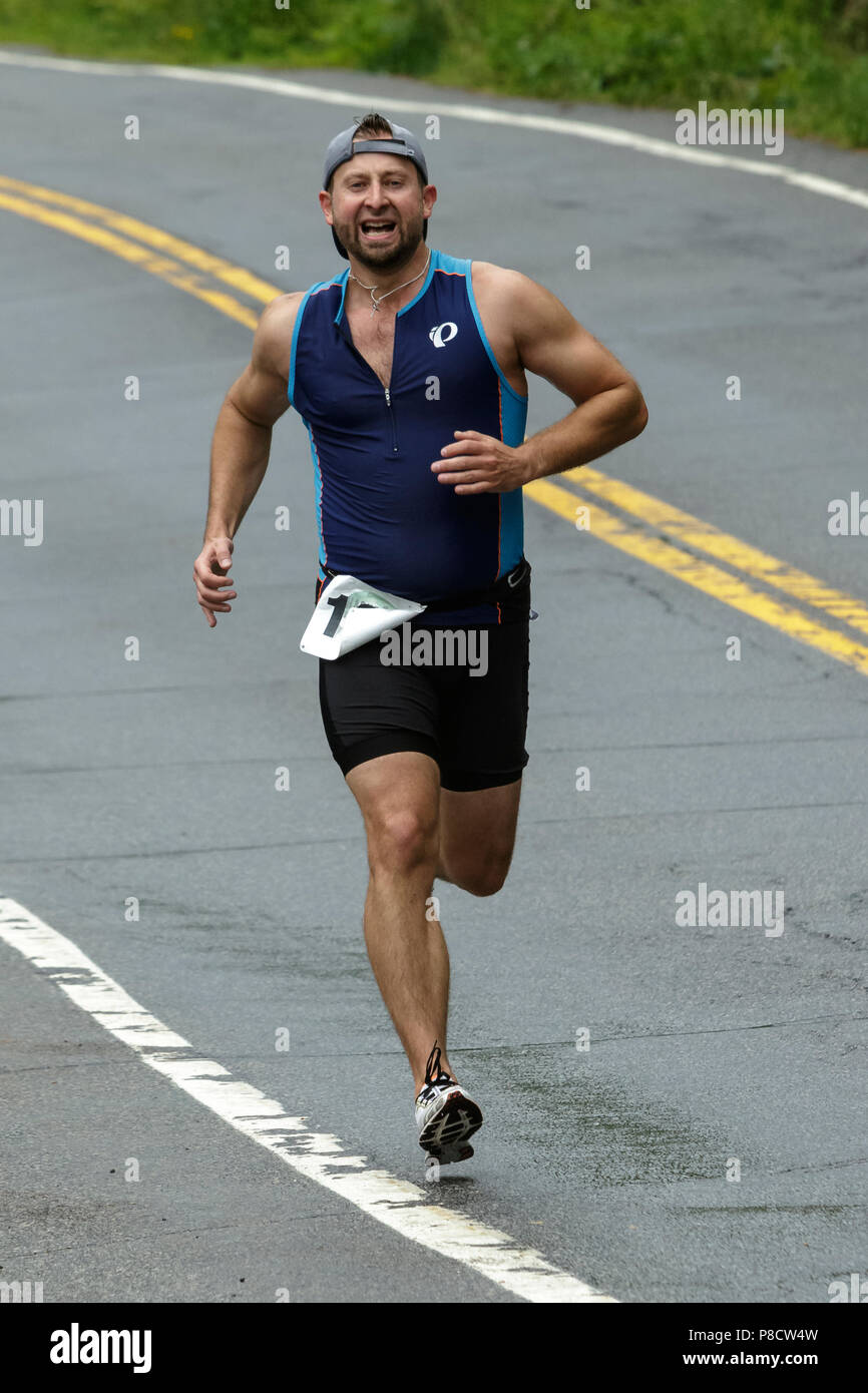 Male competitor during the run segment in the 2018 Hague Endurance Festival Olympic Triathlon Stock Photo