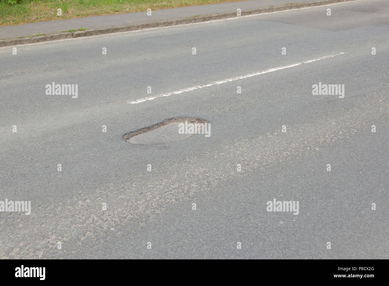 Pot holes in Carterton, Oxfordshire UK. 13th May 2018. UK Weather: Pot holes in West Oxfordshire, multiple potholes on the streets of Oxfordshire. Stock Photo