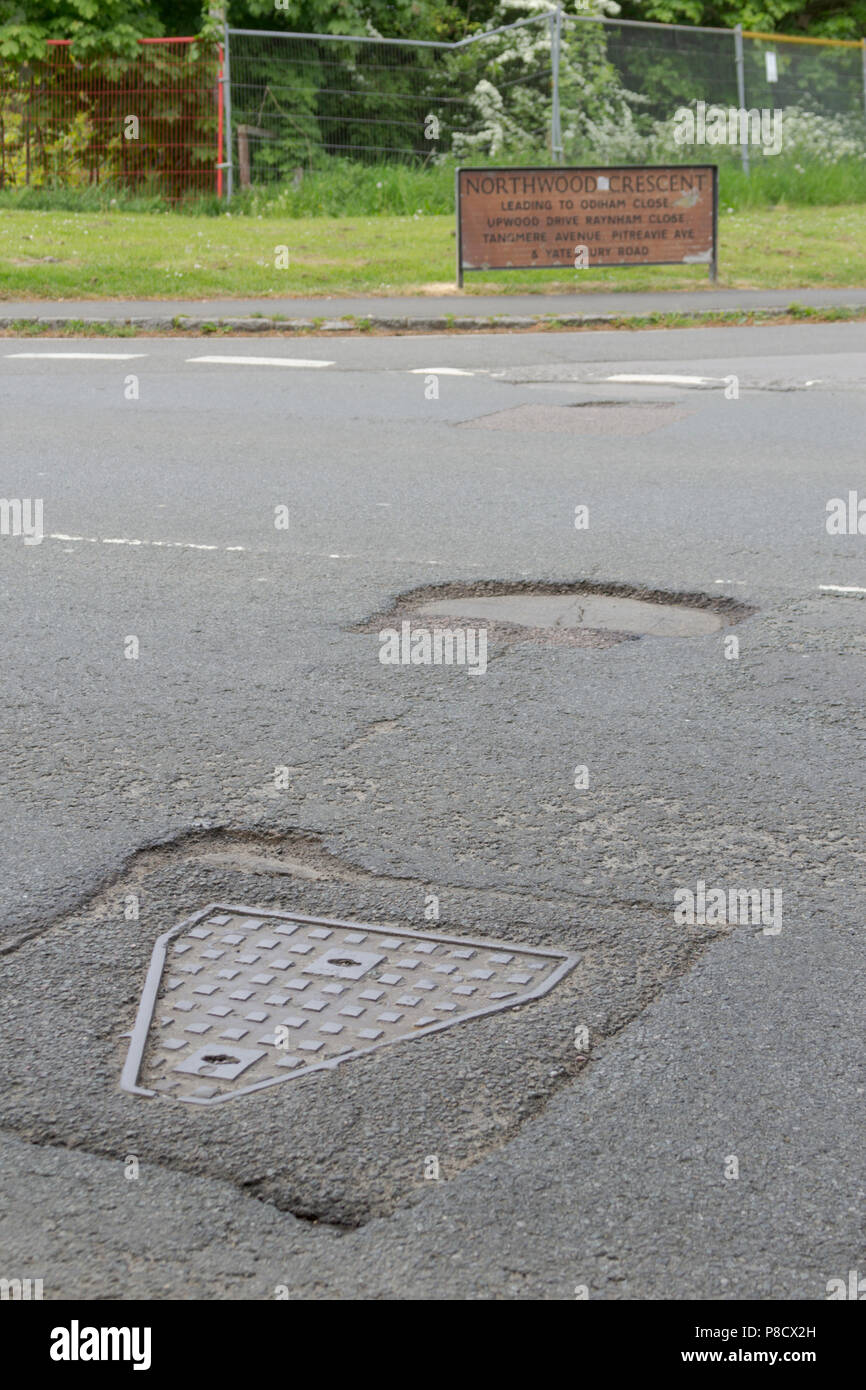 Pot holes in Carterton, Oxfordshire UK. 13th May 2018. UK Weather Pot