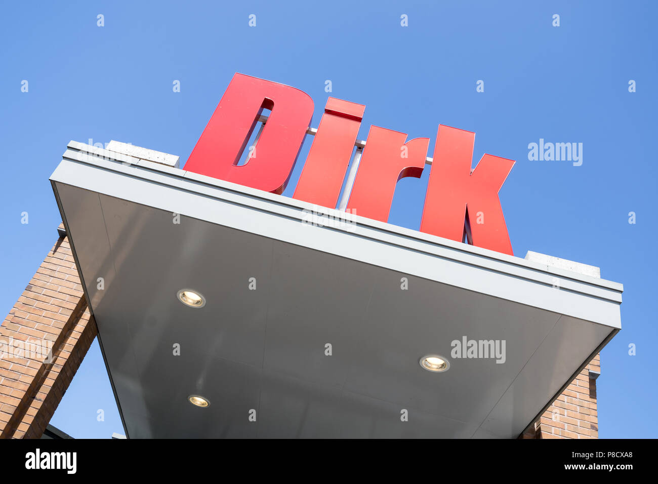 Dirk sign at branch. Dirk van den Broek is a Dutch retail company and a member of Superunie, a Dutch purchasing organization for supermarkets. Stock Photo