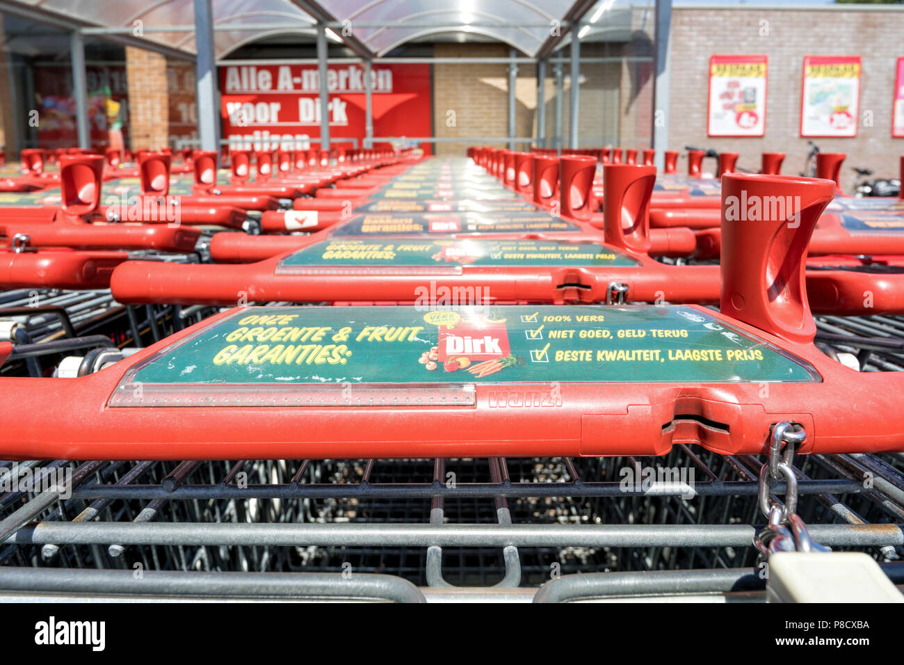 Dirk shopping carts. Dirk van den Broek is a Dutch retail company and a member of Superunie, a Dutch purchasing organization for supermarkets. Stock Photo
