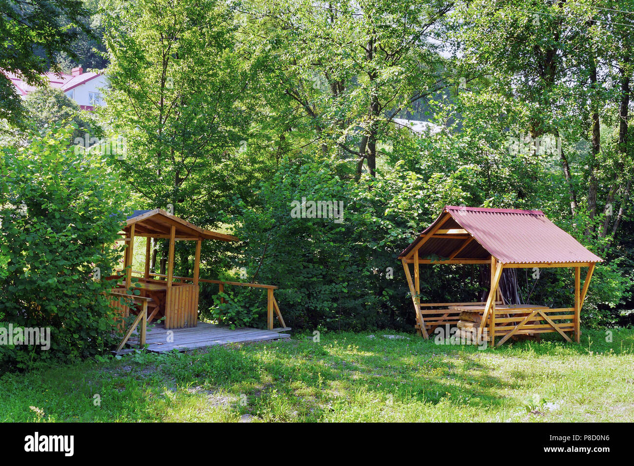 A Shelter For Rest With Benches And A Table Standing In The Shade