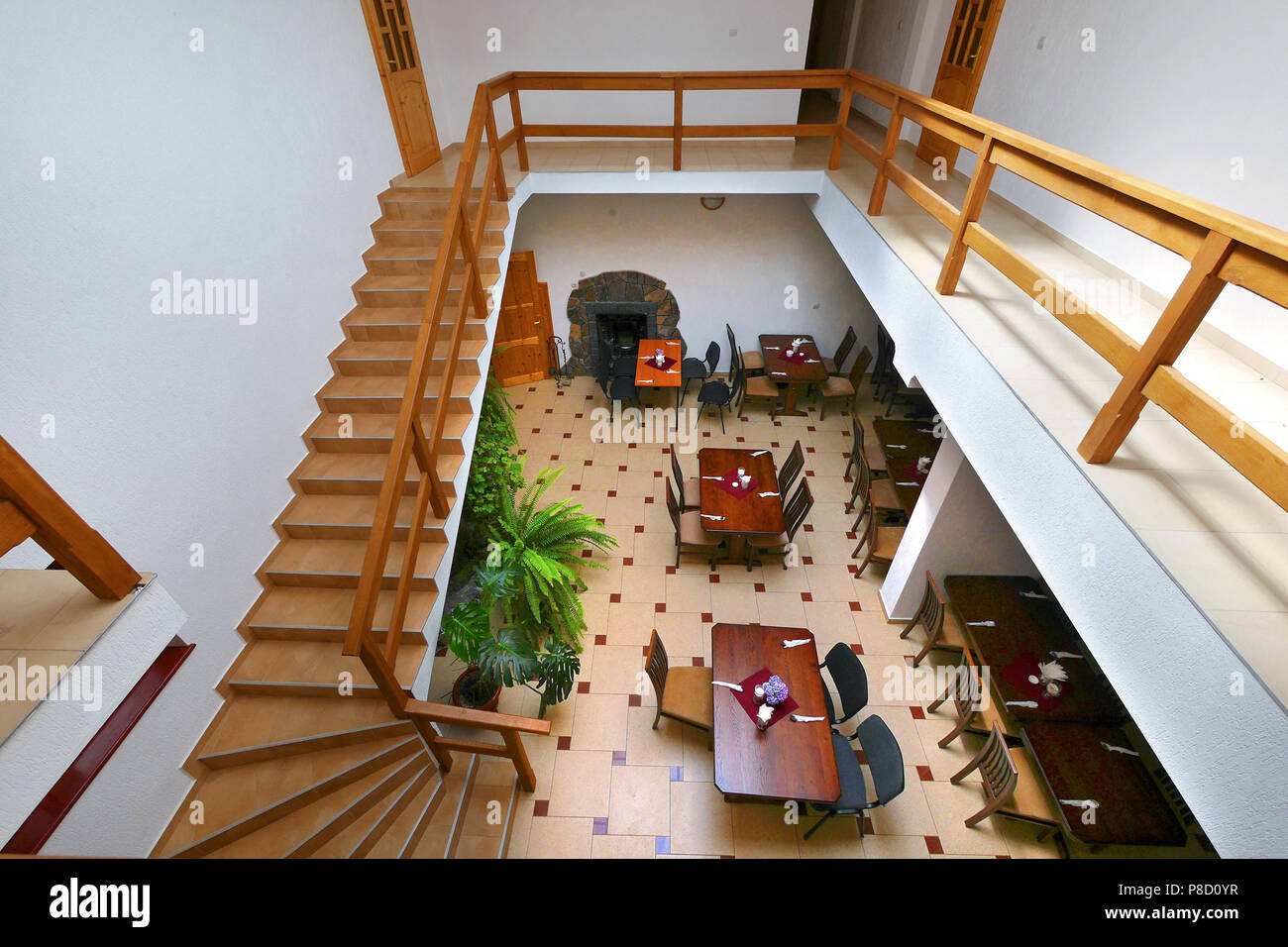 view from above to the banquet hall with tables chairs from the stairs ...