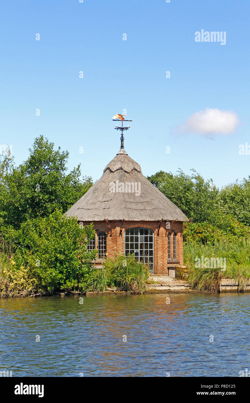 A summerhouse by the River Bure on the Norfolk Broads downstream of the