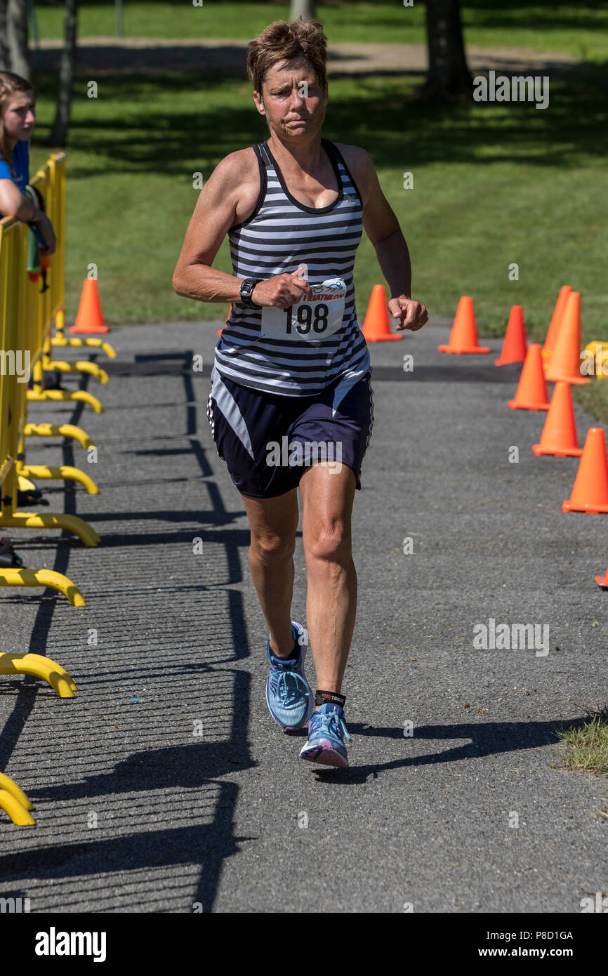 Mary Sheehan competing in the run segment in the 2018 Stissing Triathlon Stock Photo