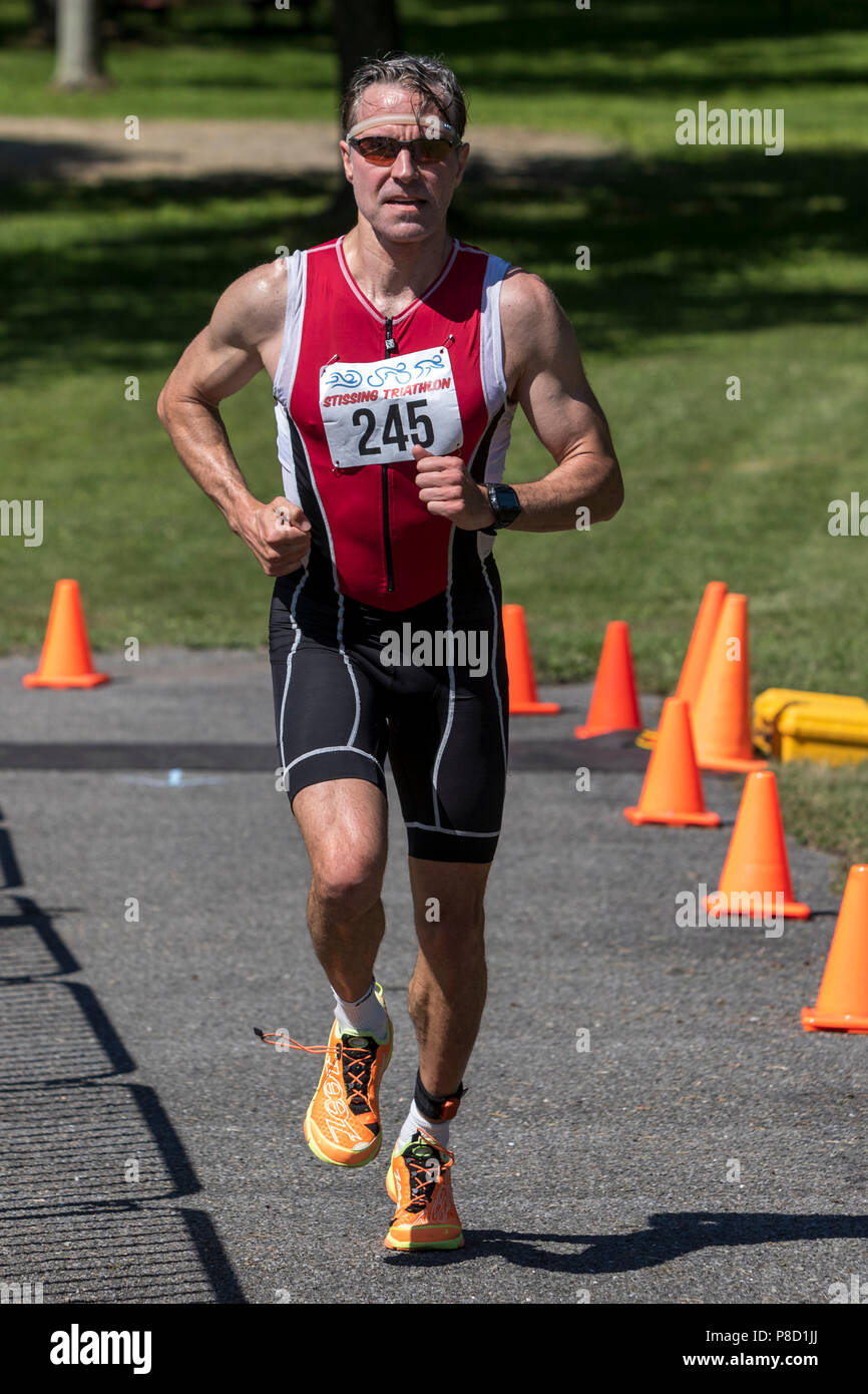 David Nadel competiting in the run segment in the 2018 Stissing Triathlon Stock Photo