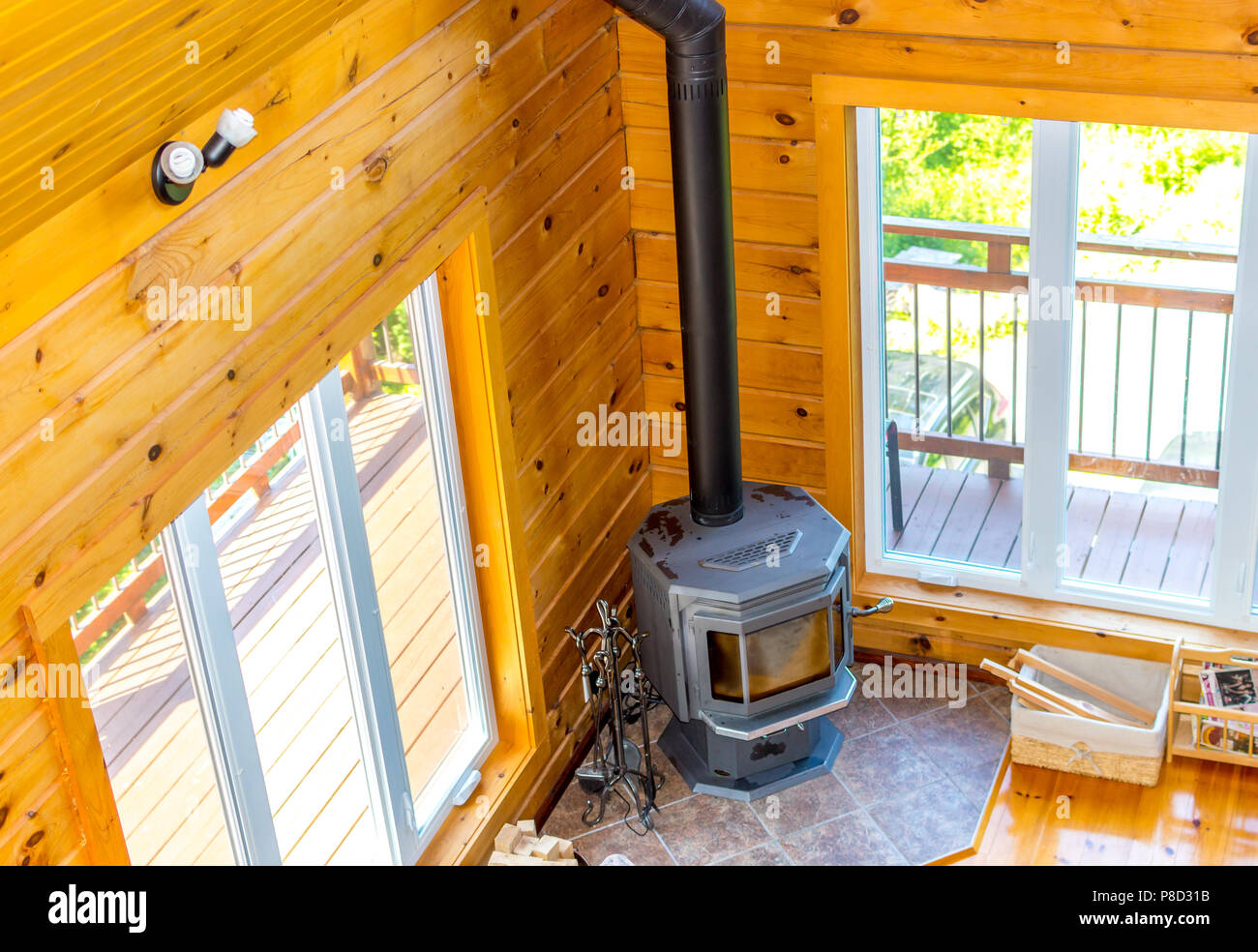 Wooden fireplace in a wooden cottage in forest in Quebec, Canada Stock